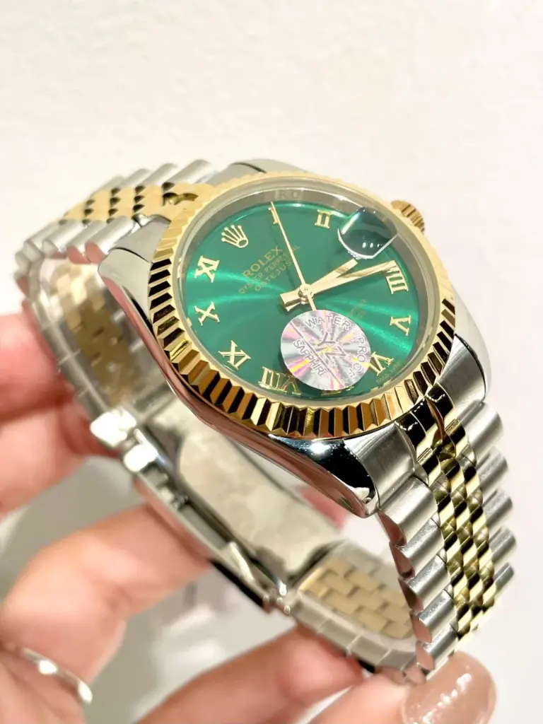 Rolex Datejust featuring a two-tone yellow gold-28