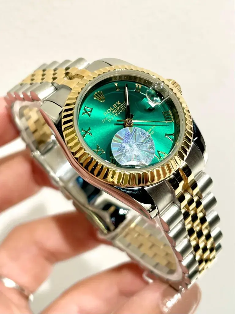 Rolex Datejust watch featuring a green-29